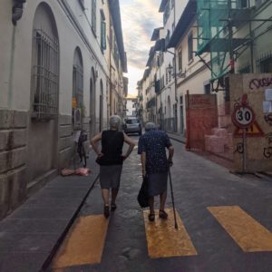 Two women walking in street