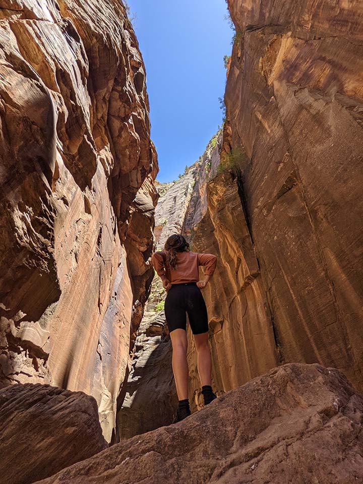 Female dressed in hiking clothes in Zion National Park.